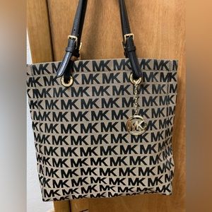 Michael Kors, tote with  four pockets, one large zipper compartment